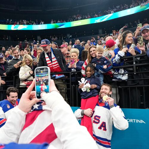 FILE - United States' Jaccob Slavin (74) poses with his gold medal after the men's ice hockey gold medal game between Canada and the United States at the 2026 Winter Olympics, in Milan, Italy, Feb. 22, 2026. (AP Photo/Hassan Ammar, File)