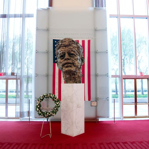FILE - A memorial wreath stands next to the bronze memorial bust by Robert Berks of President John F. Kennedy in the grand foyer at the John F. Kennedy Center for the Performing Arts in Washington, Nov. 22, 2013, on the 50th anniversary of Kennedy's death. (AP Photo/Carolyn Kaster, File)