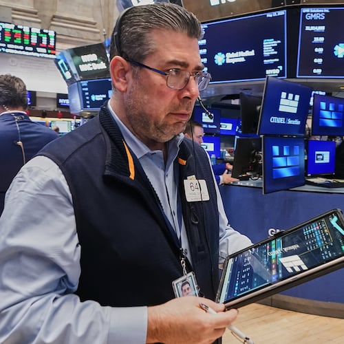 Trader Michael Capolino works on the floor of the New York Stock Exchange, Wednesday, May 13, 2026. (AP Photo/Richard Drew)