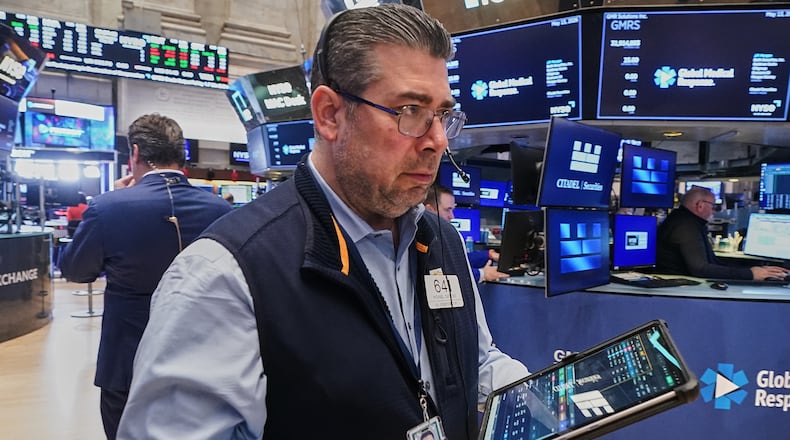 Trader Michael Capolino works on the floor of the New York Stock Exchange, Wednesday, May 13, 2026. (AP Photo/Richard Drew)