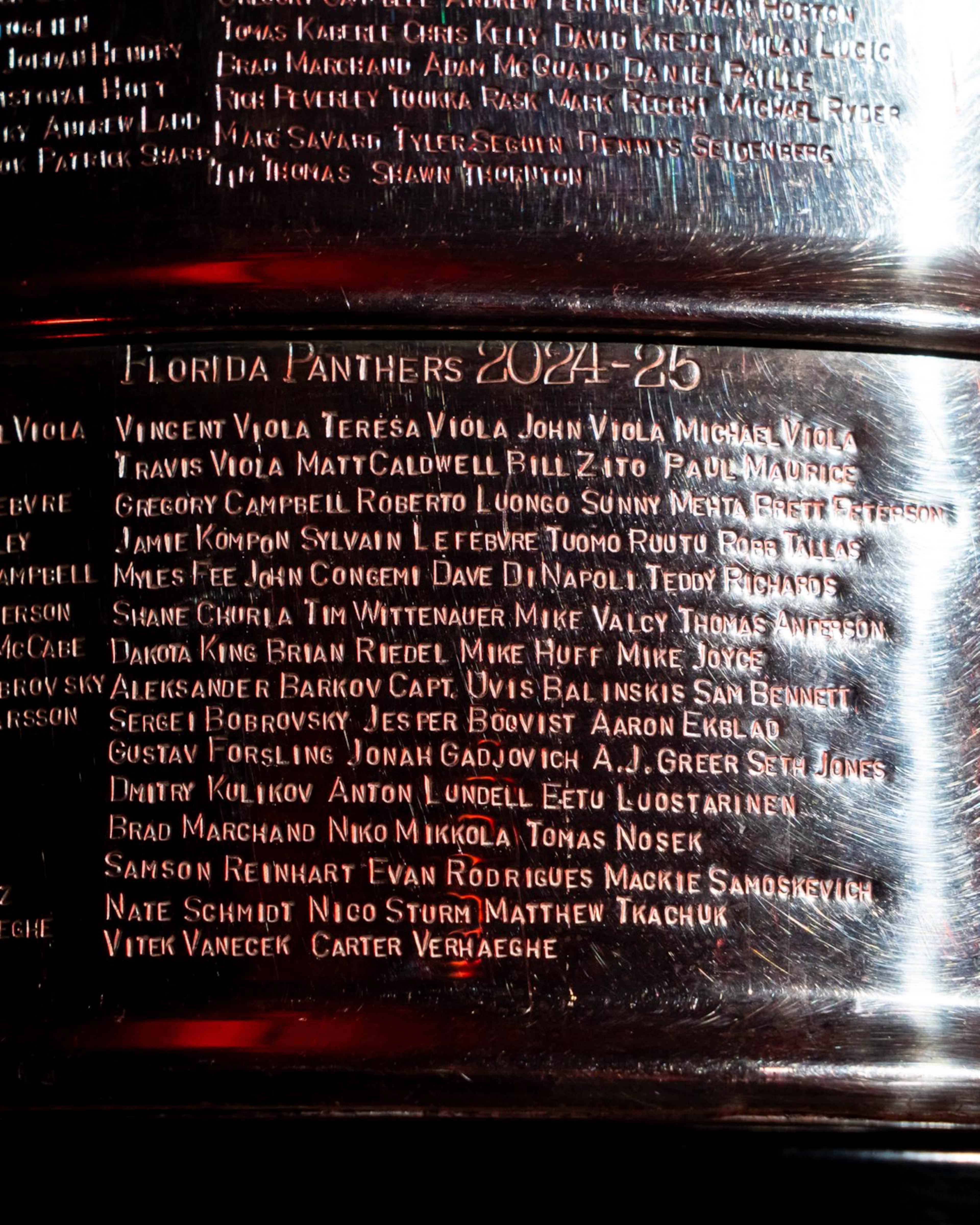 A closeup of the engraving of the names of the Florida Panthers NHL champions for the 2024-25 season on the actual Stanley Cup. As an off-ice member of the organization, Mike Huff was included at the behest of players. (Courtesy of Mike Huff)