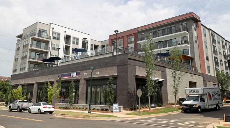 A Sandy Springs apartment community on Roswell Road. Sandy Springs is working to find ways to ensure more of its apartments and multi-family housing is affordable to "workforce" employees such as teachers and first responders. (JASON GETZ/SPECIAL TO THE AJC)