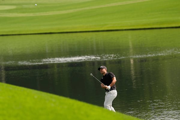 Xander Schauffele chips to the green on the 16th hole during the first round of the PGA Championship golf tournament at the Quail Hollow Club, Thursday, May 15, 2025, in Charlotte, N.C. (AP Photo/David J. Phillip)
