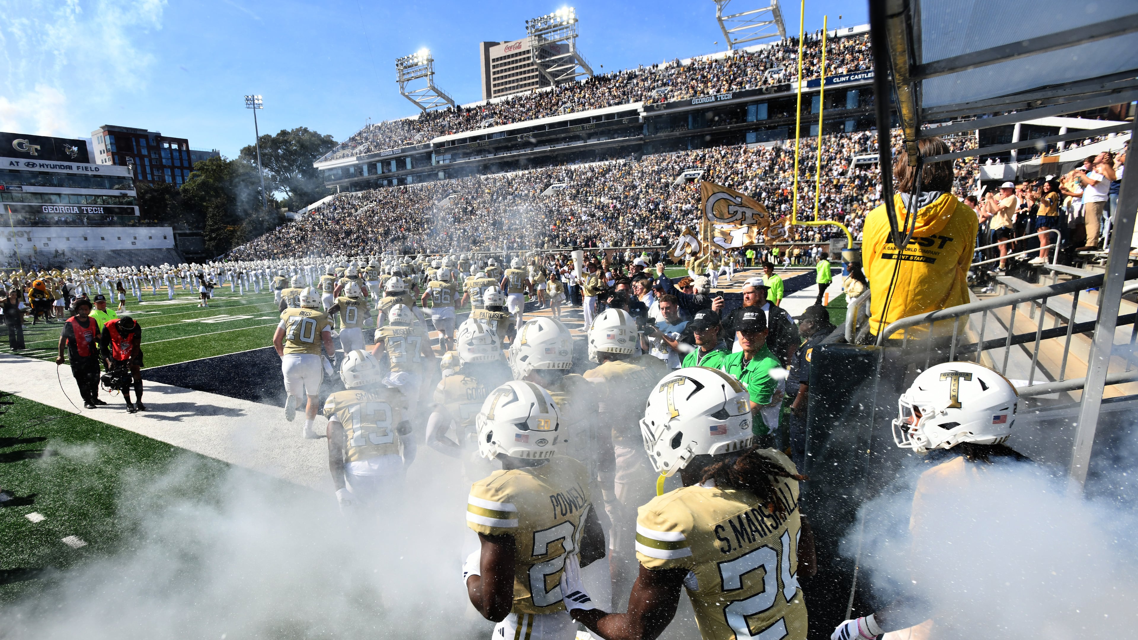 Georgia Tech's Ramblin' Wreck leads the band, cheerleaders, Buzz, players, and coaches before an NCAA college football game against Syracuse at Bobby Dodd Stadium, Saturday, Oct. 25, 2025, in Atlanta. (Hyosub Shin/AJC)
