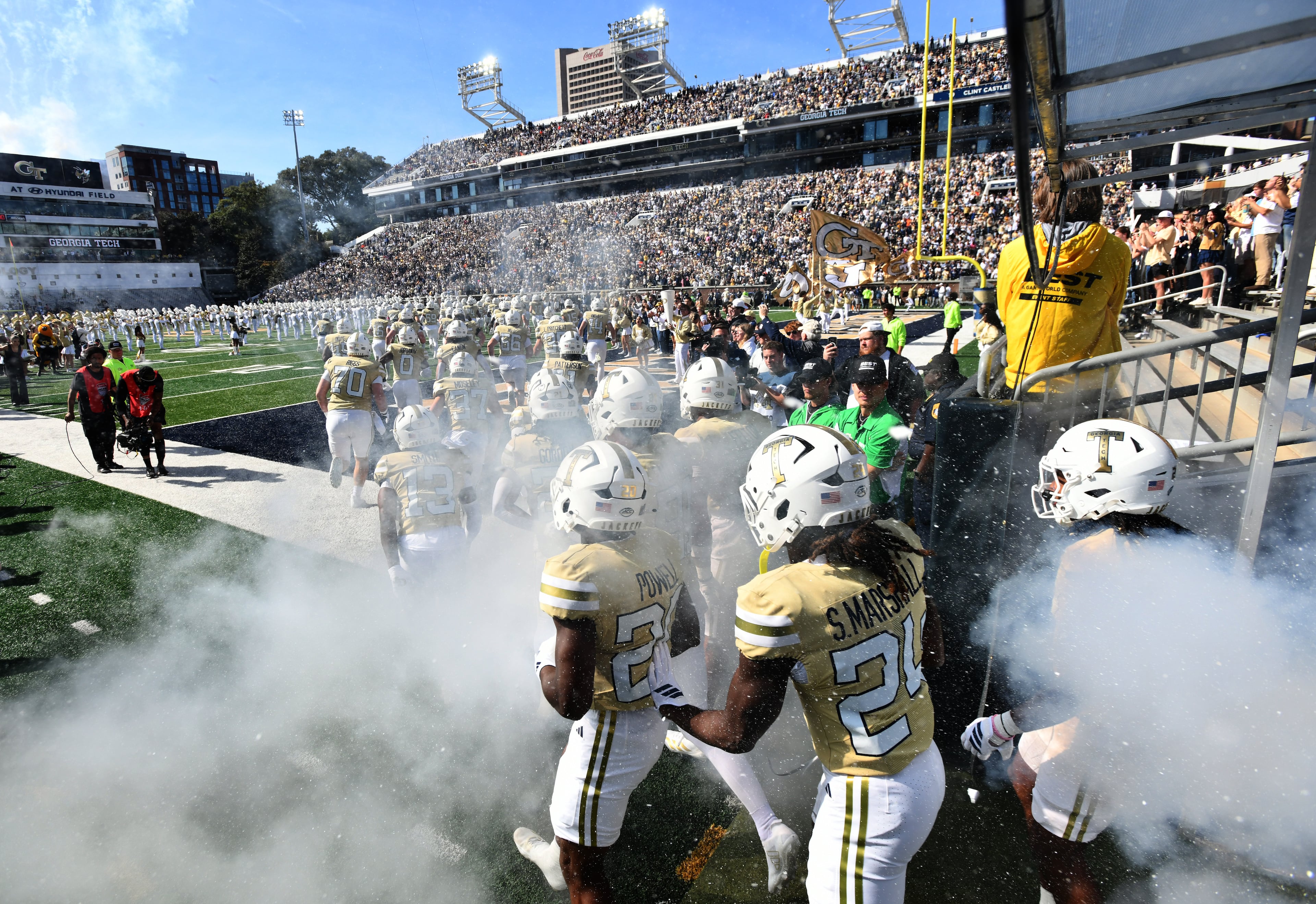 Georgia Tech's Ramblin' Wreck leads the band, cheerleaders, Buzz, players, and coaches before an NCAA college football game against Syracuse at Bobby Dodd Stadium, Saturday, October 25, 2025 in Atlanta. (Hyosub Shin / AJC)