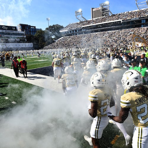 Georgia Tech's Ramblin' Wreck leads the band, cheerleaders, Buzz, players, and coaches before an NCAA college football game against Syracuse at Bobby Dodd Stadium, Saturday, October 25, 2025 in Atlanta. (Hyosub Shin / AJC)