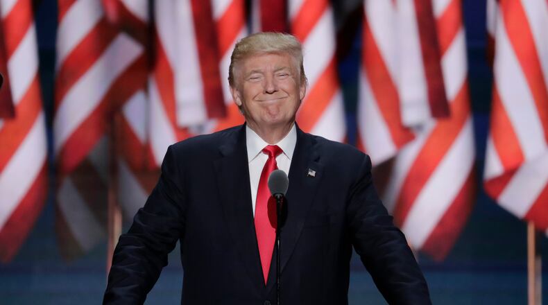 Donald J. Trump, smiles as he takes the stage at the Republican National Convention. (AP Photo/J. Scott Applewhite)