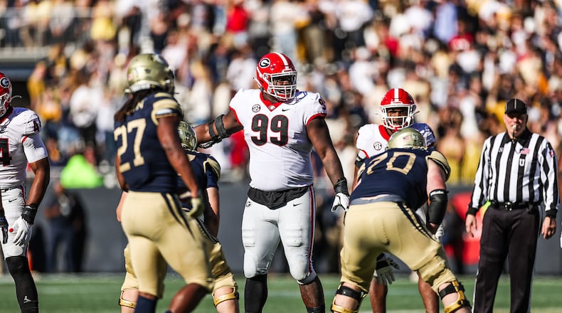 Georgia defensive lineman Jordan Davis (99) motions to the Bulldogs' linebackers during the Georgia Tech game at Bobby Dodd Stadium on Saturday, Nov. 27, 2021. (Photo by Tony Walsh/UGA Athletics)