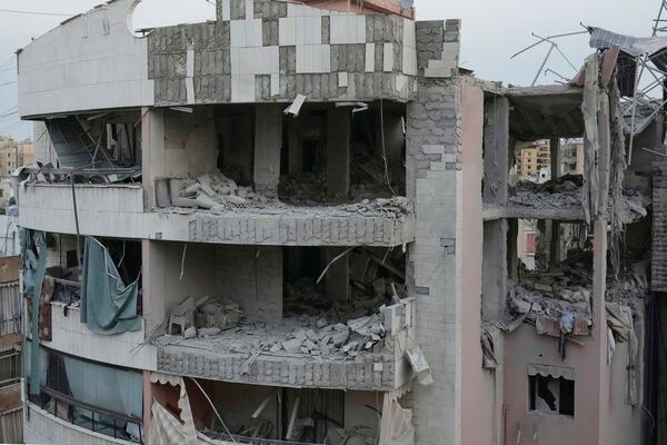 Damaged apartment buildings are seen after being struck earlier by an Israeli attack in Dahiyeh, a southern suburb of Beirut, Lebanon, early Tuesday, April 1, 2025. (AP Photo/Hussein Malla)
