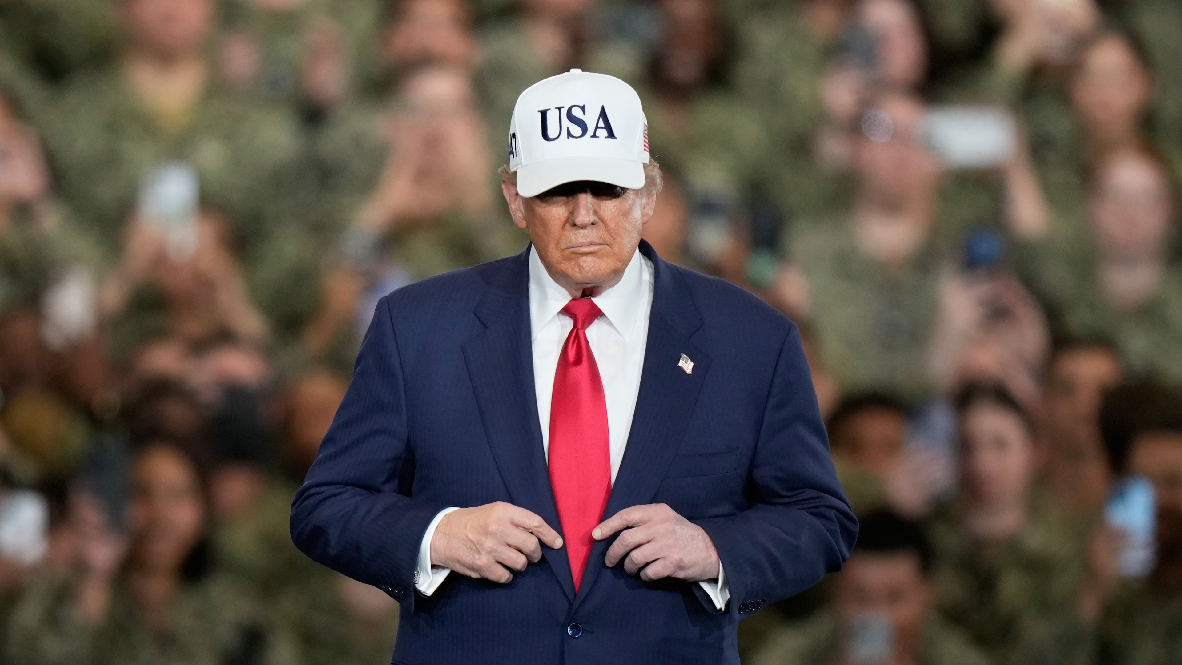 U.S. President Donald Trump arrives to meet with soldiers and servicemen at the USS George Washington at the U.S. Navy's Yokosuka base in Yokosuka, south of Tokyo, Tuesday, Oct. 28, 2025. (AP Photo/Eugene Hoshiko)