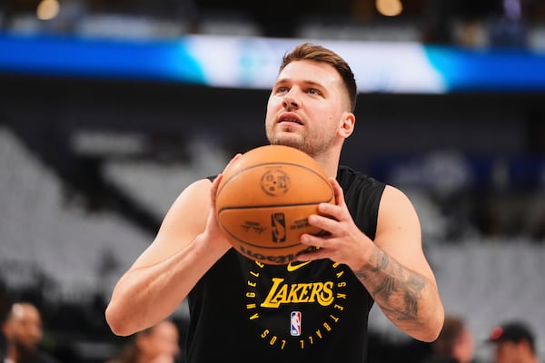 Los Angeles Lakers' Luka Doncic warms up before an NBA basketball game against the Dallas Mavericks in Dallas, Wednesday, April 9, 2025. (AP Photo/LM Otero)