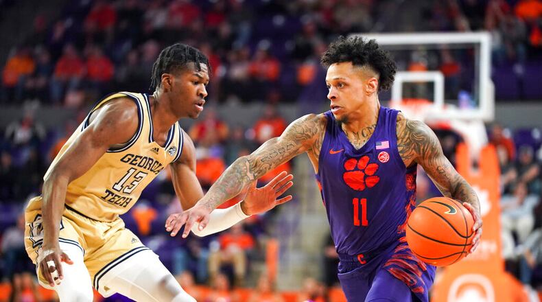 Clemson guard Brevin Galloway (11) drives against Georgia Tech guard Miles Kelly (13) during the first half of an NCAA college basketball game Tuesday, Jan. 24, 2023, in Clemson, S.C. (AP Photo/Sean Rayford)