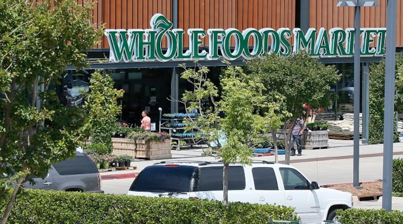 Whole Foods Market discriminated against its employees when it barred them from wearing Black Lives Matter face coverings while on the job, according to a federal lawsuit filed Monday in Boston. (File/AP Photo/Sue Ogrocki)
