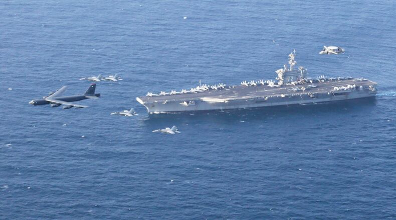 FILE - The USS Abraham Lincoln carrier and a U.S. Air Force B-52H Stratofortress, conduct joint exercises in the U.S. Central Command area of responsibility in Arabian Sea June 1, 2019. (Mass Communication Specialist 1st Class Brian M. Wilbur/U.S. Navy via AP, File)