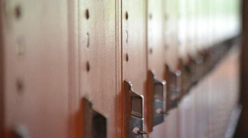 A Connecticut school district employee is out of a job after a viral video appeared to show her shouting racial slurs and spitting at at a black man at an East Haven supermarket.