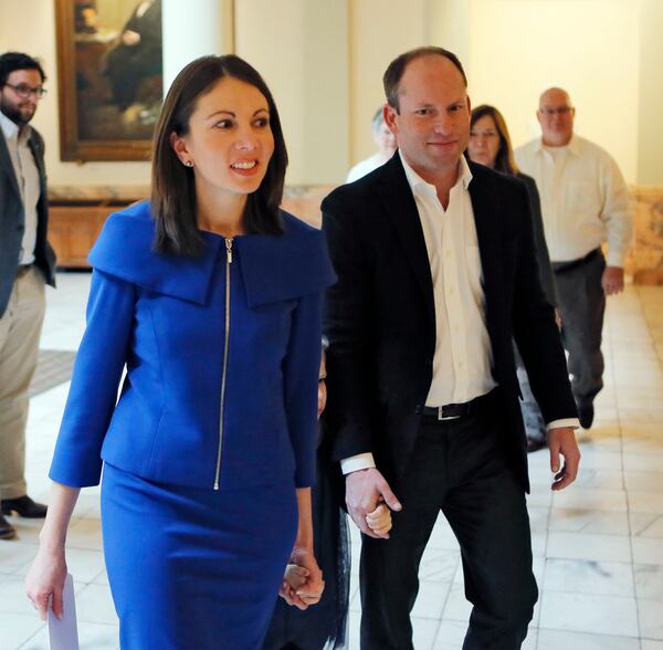 Stacey Evans arrives with her husband Andrew and other family members to qualify for the governors race. BOB ANDRES /BANDRES@AJC.COM