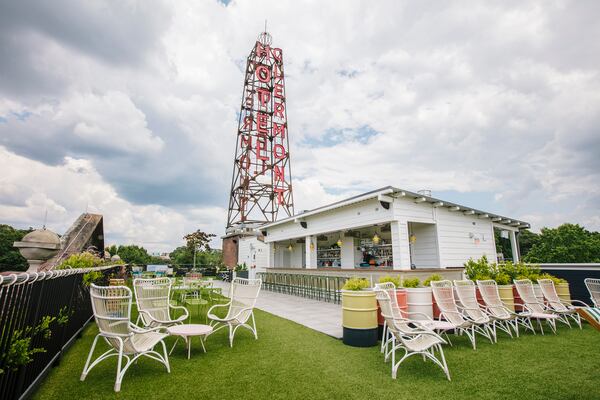 The artificial turf-covered rooftop at the Clermont Hotel is an Instagramers paradise with panoramic city views, a neon radio tower, and plenty of spaces to perch with a beverage. (Asher Moss/Courtesy of Clermont Hotel)