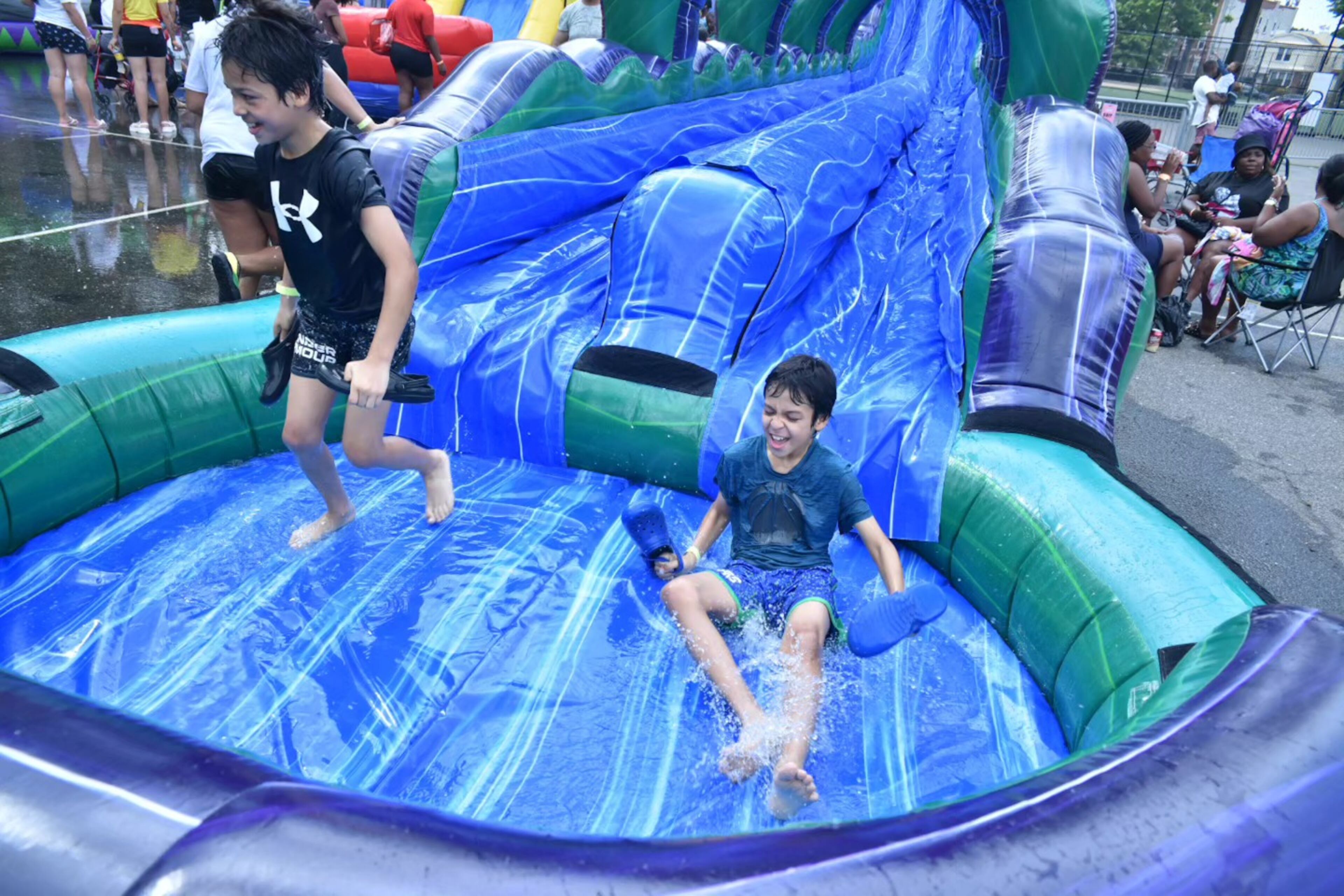 You can slide down more than 25 inflatable water slides, navigate an obstacle course and more at the pop-up Slide City Waterpark at Atlantic Station. (Courtesy of Slide City Waterpark)