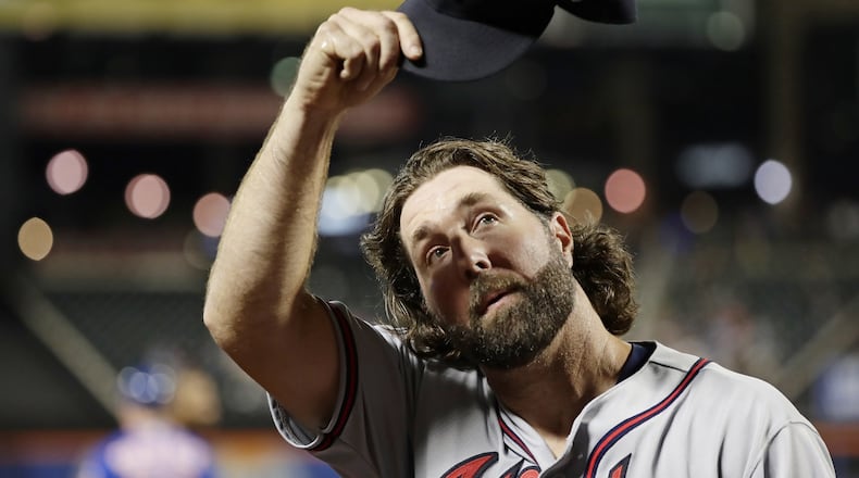 Braves pitcher R.A. Dickey tipped his cap to Mets fans as he left the field Tuesday in what turned out to be his final start of the season and possibly his career. (AP Photo/Frank Franklin II)