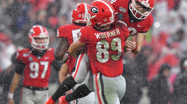 November 23, 2019 Athens - Georgia place kicker Rodrigo Blankenship (98) celebrates with Georgia tight end Charlie Woerner (89) after he scored a field goal during the first half of an NCAA college football game at Sanford Stadium on Saturday, November 23, 2019. Georgia won 19-13 over the Texas A&M. (Hyosub Shin / Hyosub.Shin@ajc.com)