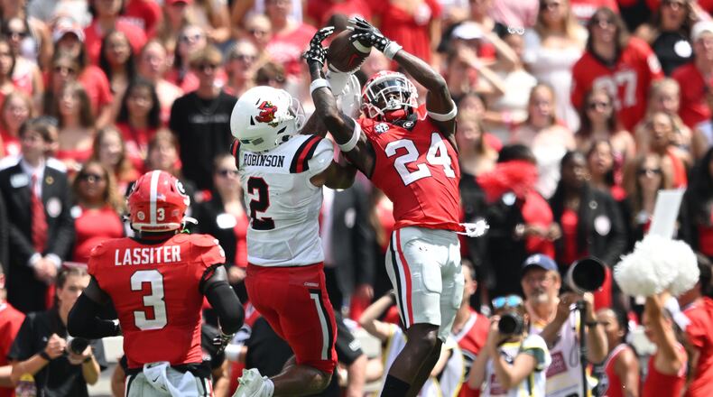 Georgia defensive back Malaki Starks (24) intercepts a pass intended for Ball State wide receiver Ty Robinson (2) during the first half at Sanford Stadium on Saturday, Sept. 9, 2023, in Athens, Georgia. Georgia won, 45-3. (Hyosub Shin/The Atlanta Journal-Constitution/TNS)