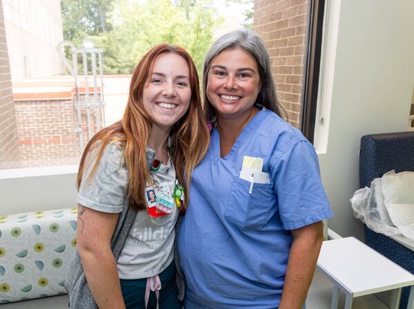 Averie Olson (left) poses with Jen Wheelus CPNP-AC
 at Children's Healthcare of Atlanta Scottish Rite. Averie suffers from Moyamoya, a rare disease that can bring on strokes. She was treated at Scottish Rite & now works as a nurse in the neurology unit with a doctor she believes saved her life.  PHIL SKINNER FOR THE ATLANTA JOURNAL-CONSTITUTION