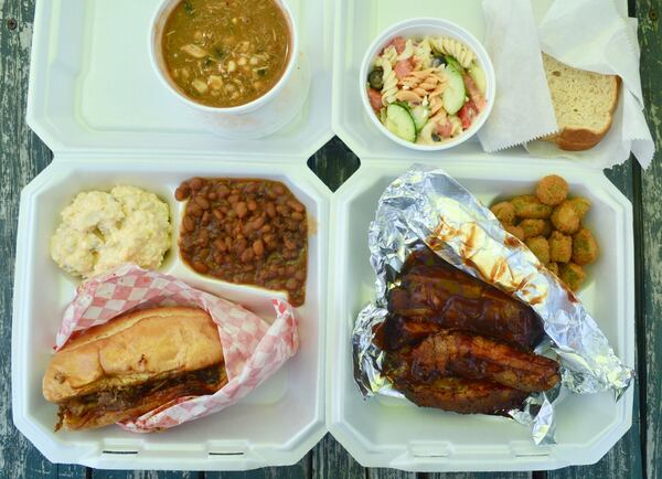 A brisket sandwich plate (left) and a rib plate (right) from My Way Cafe food truck, which was one of the food trucks at the Atlanta Food Truck Park & Market on a recent Saturday. CONTRIBUTED BY HENRI HOLLIS