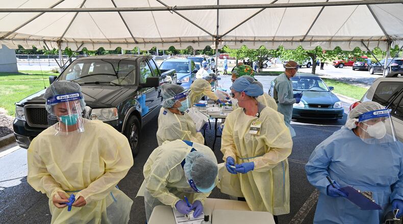 The Gainesville area has become Georgia’s new coronavirus hot spot. Northeast Georgia Health System and the Good News Clinic are testing Hall County adults and children for COVID-19 at two drive-through testing sites. One of the sites is shown here. (PHOTO by Hyosub Shin / Hyosub.Shin@ajc.com)