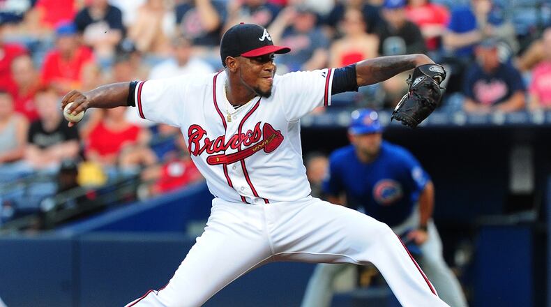Julio Teheran #49 of the Atlanta Braves throws a first inning pitch against the Chicago Cubs at Turner Field on July 17, 2015 in Atlanta, Georgia. (Photo by Scott Cunningham/Getty Images)