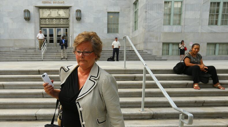 Former DeKalb County Commissioner Elaine Boyer made no comment as she left federal court after her arraignment hearing for bilking taxpayers out of thousands of dollars through a kickback scheme on Sept. 3, 2014. CURTIS COMPTON / CCOMPTON@AJC.COM