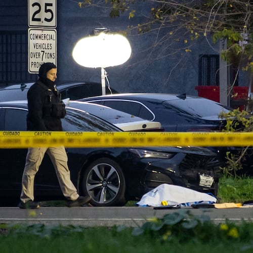Investigators examine the scene of a mass shooting Sunday, Nov. 30, 2025, in Stockton, Calif. (AP Photo/Ethan Swope)