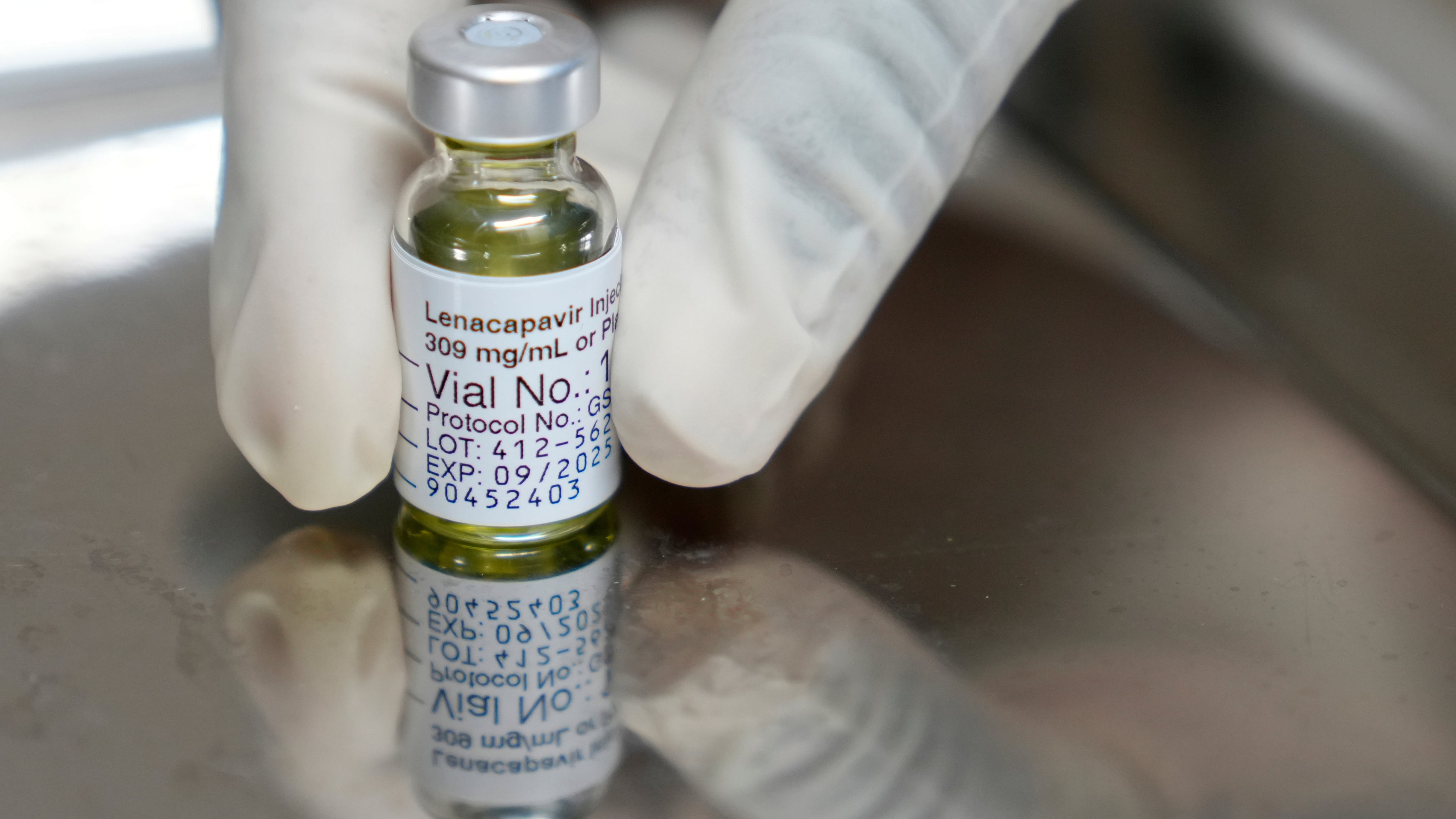 FILE - A pharmacist holds a vial of lenacapavir, an injectable HIV prevention drug, at the Desmond Tutu Health Foundation's Masiphumelele Research Site, in Cape Town, South Africa, July 23, 2024. (AP Photo/Nardus Engelbrecht, File)