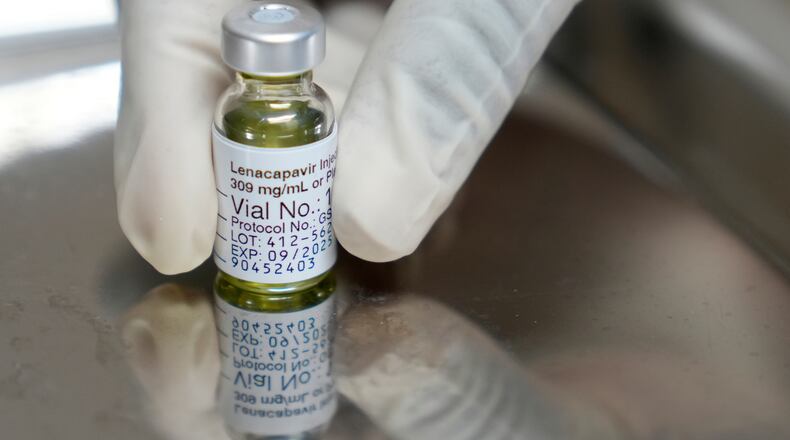 FILE - A pharmacist holds a vial of lenacapavir, an injectable HIV prevention drug, at the Desmond Tutu Health Foundation's Masiphumelele Research Site, in Cape Town, South Africa, July 23, 2024. (AP Photo/Nardus Engelbrecht, File)