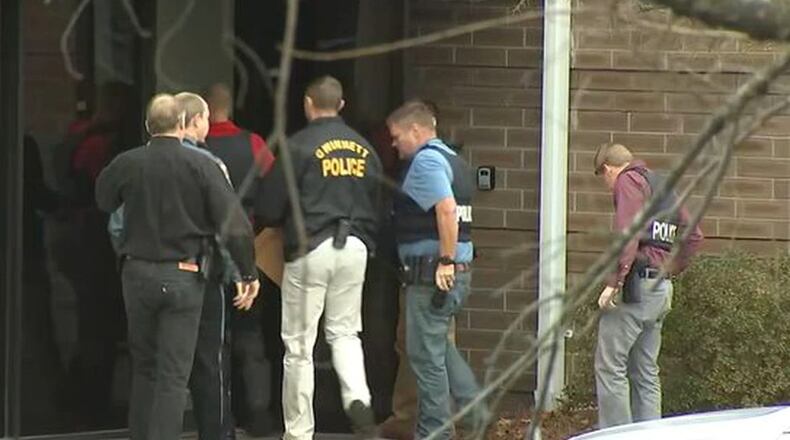 Officers raiding Lakeview facility (WSBTV.com)