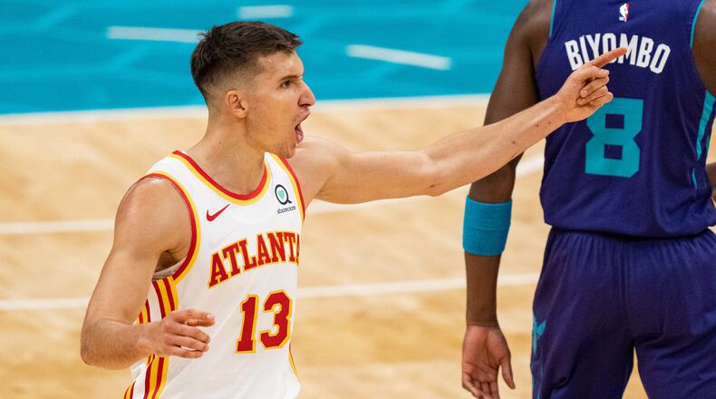 Bogdan Bogdanovic (13) of the Atlanta Hawks reacts to a call against the Charlotte Hornets in the fourth quarter during their game at Spectrum Center on April 11, 2021 in Charlotte, North Carolina. (Jacob Kupferman/Getty Images/TNS)