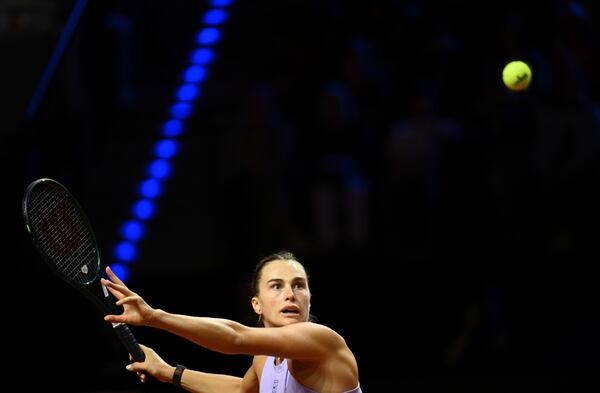 Belarus' Aryna Sabalenka in action against Latvia's Jelena Ostapenko during the women's singles final tennis match of the WTA tour, in Stuttgart, Germany, Monday, April 21, 2025. (Marijan Murat/dpa via AP)