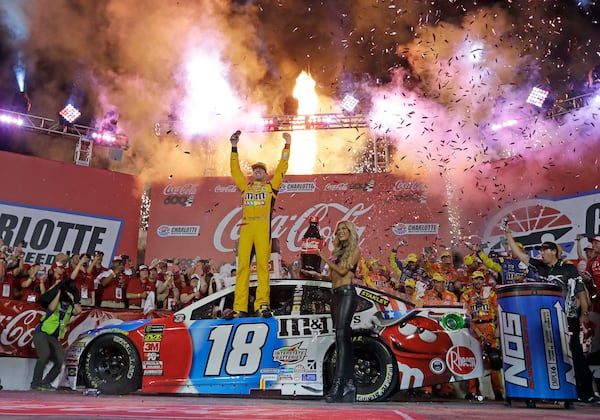 Kyle Busch celebrates after winning the NASCAR Cup Series auto race at Charlotte Motor Speedway in Charlotte, N.C., Sunday, May 27, 2018. (Chuck Burton/AP File)