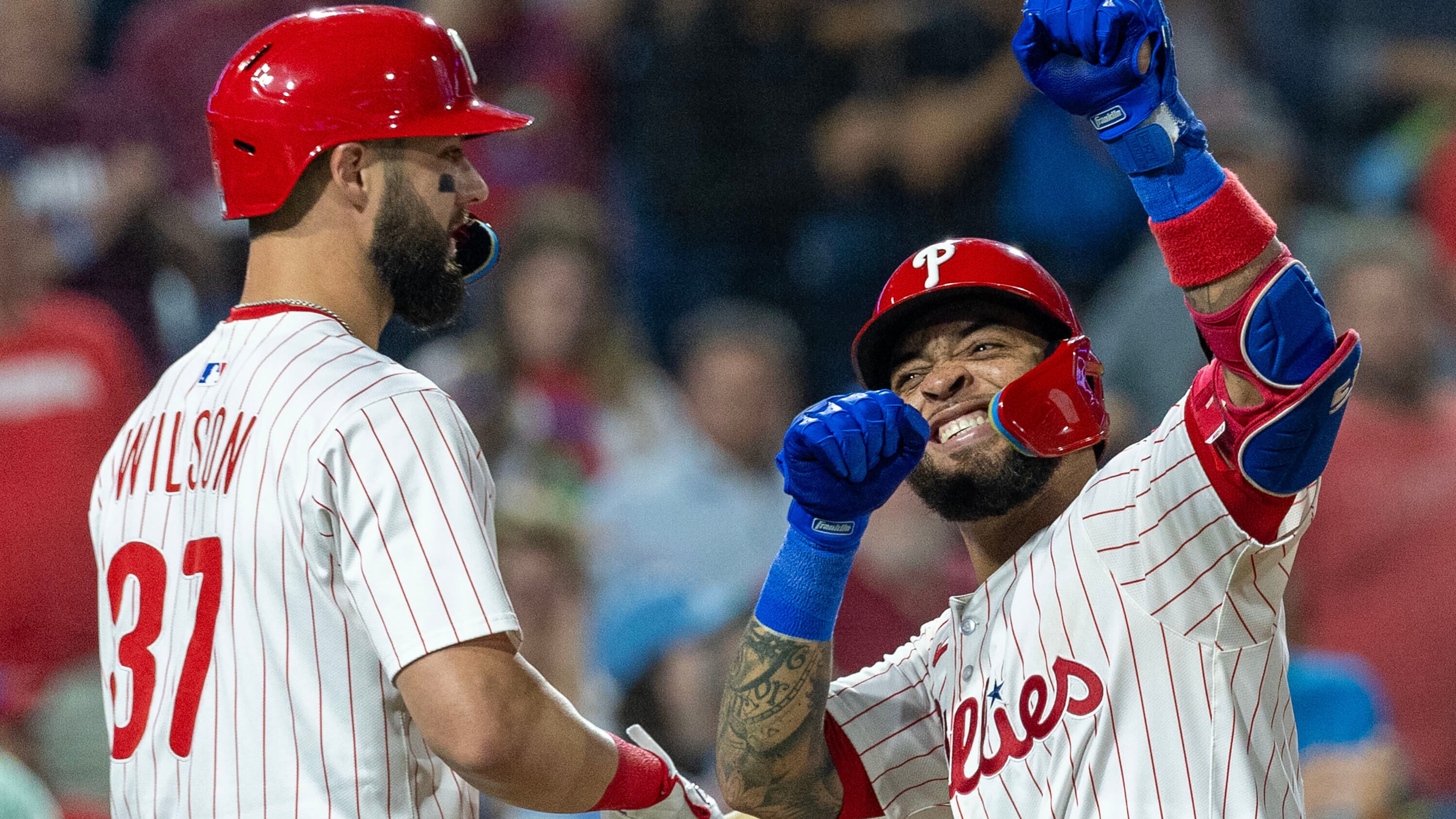 Philadelphia Phillies' Edmundo Sosa, right, celebrates with Weston Wilson (37) after hitting a two run homer in the fifth inning of a baseball game against the Miami Marlins, Wednesday, Sept. 24, 2025, in Philadelphia. (AP Photo/Laurence Kesterson)