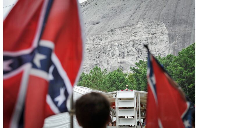 Confederate flag sympathizers marched past the carved monument on their way to the top of Stone Mountain earlyer this month.