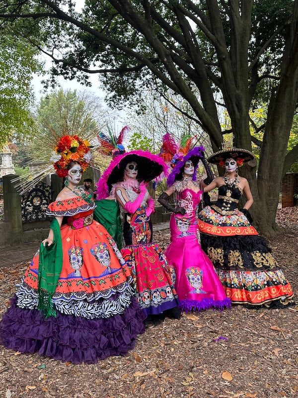 Four women dressed in elaborate la Catrina dresses celebrate Dia de los Muertos in Oakland Cemetery in 2024. (Courtesy of Kristy A. Gomez)