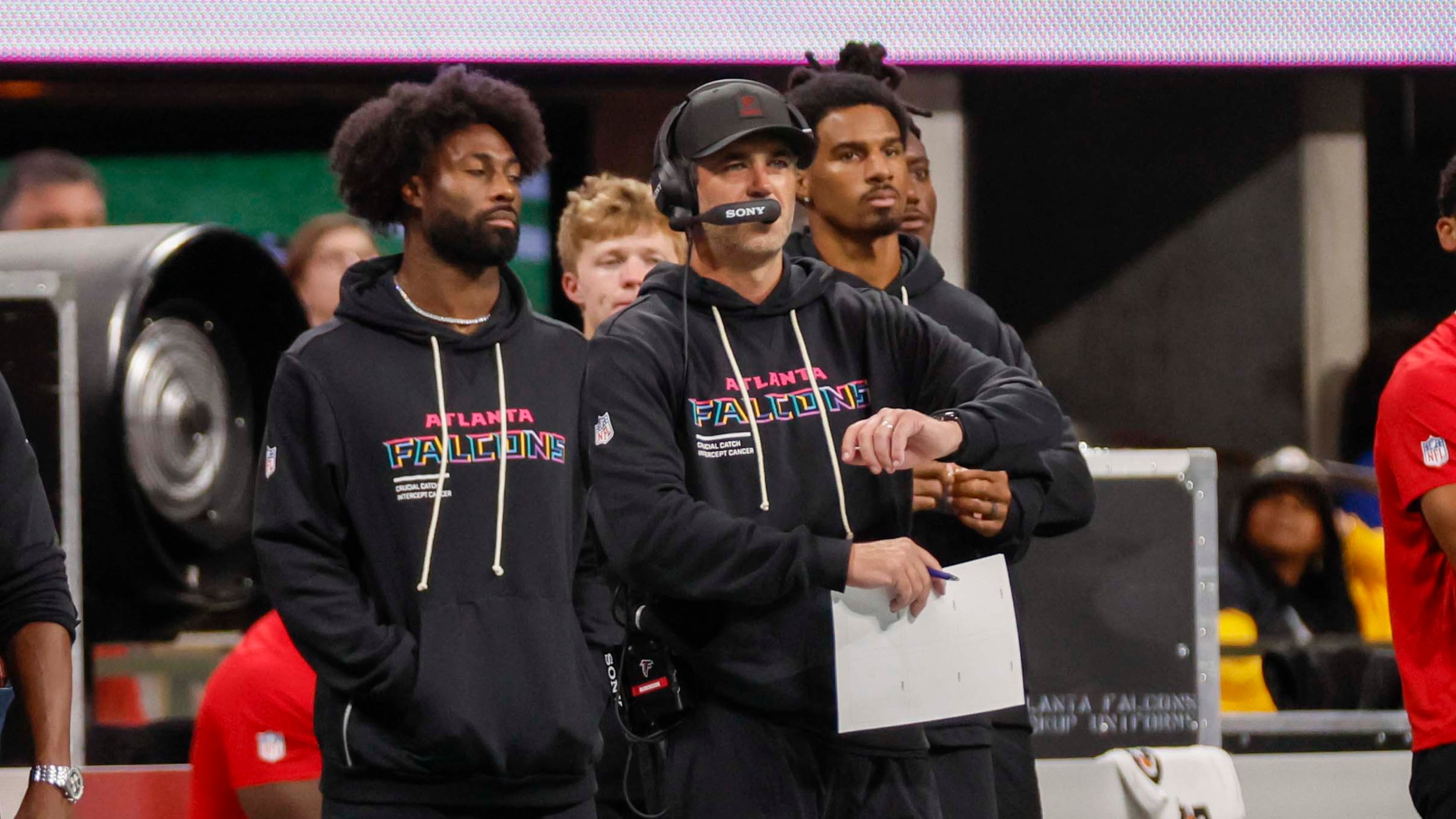 Atlanta Falcons offensive coordinator Zac Robinson (center) is seen on the sidelines  during the second half of an NFL football game against the Washington Commanders at Mercedes-Benz Stadium in Atlanta on Sunday, September 28, 2025. (Miguel Martinez/ AJC)