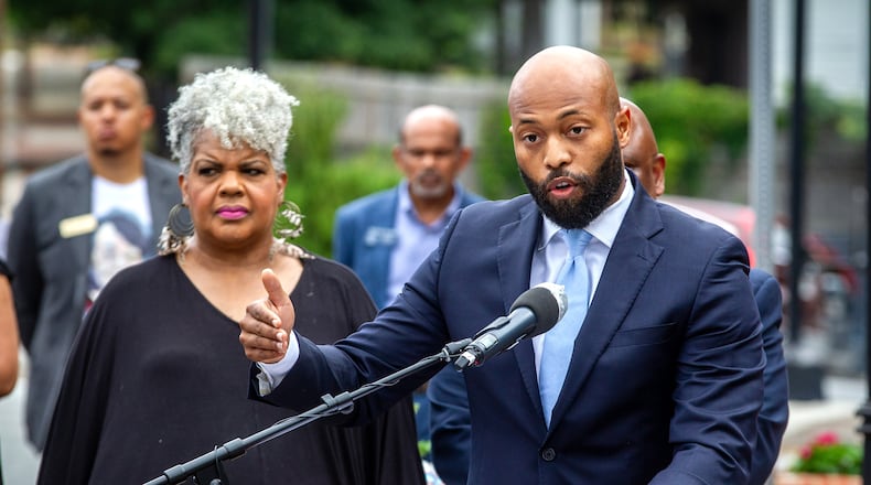 Gwinnett County Commissioner Kirkland Carden reads a proclamation during the soil collection ceremony in Lawrenceville on Juneteenth, Saturday 19, 2021, in memory of the 1911 lynching of Charles Hale. Soil from the Lawrenceville lynching site will be housed at a museum. (Photo: Steve Schaefer for The Atlanta Journal-Constitution)
