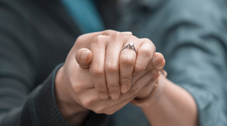 A dog-loving couple got engaged with the help of 16 furry friends.