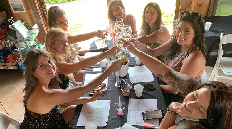 Friends enjoy the wine and ambiance at The Cottage Vineyard and Winery in Cleveland.
(Courtesy of The Cottage Vineyard and Winery)