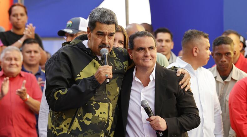 FILE - Venezuela's President Nicolas Maduro, left, and Alex Saab stand together during an event marking the anniversary of the 1958 coup that overthrew dictator Marcos Perez Jimenez, in Caracas, Venezuela, Jan. 23, 2024. (AP Photo/Jesus Vargas, File)