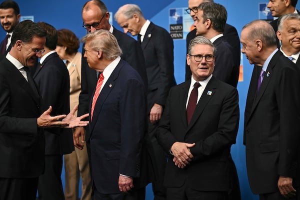 NATO Secretary General Mark Rutte, from left, President Donald Trump, Britain's Prime Minister Keir Starmer and Turkey's President Recep Tayyip Erdogan gather with NATO country leaders for a family photo during the NATO summit in The Hague, Netherlands, Wednesday, June 25, 2025. (Ben Stansall/Pool Photo via AP)