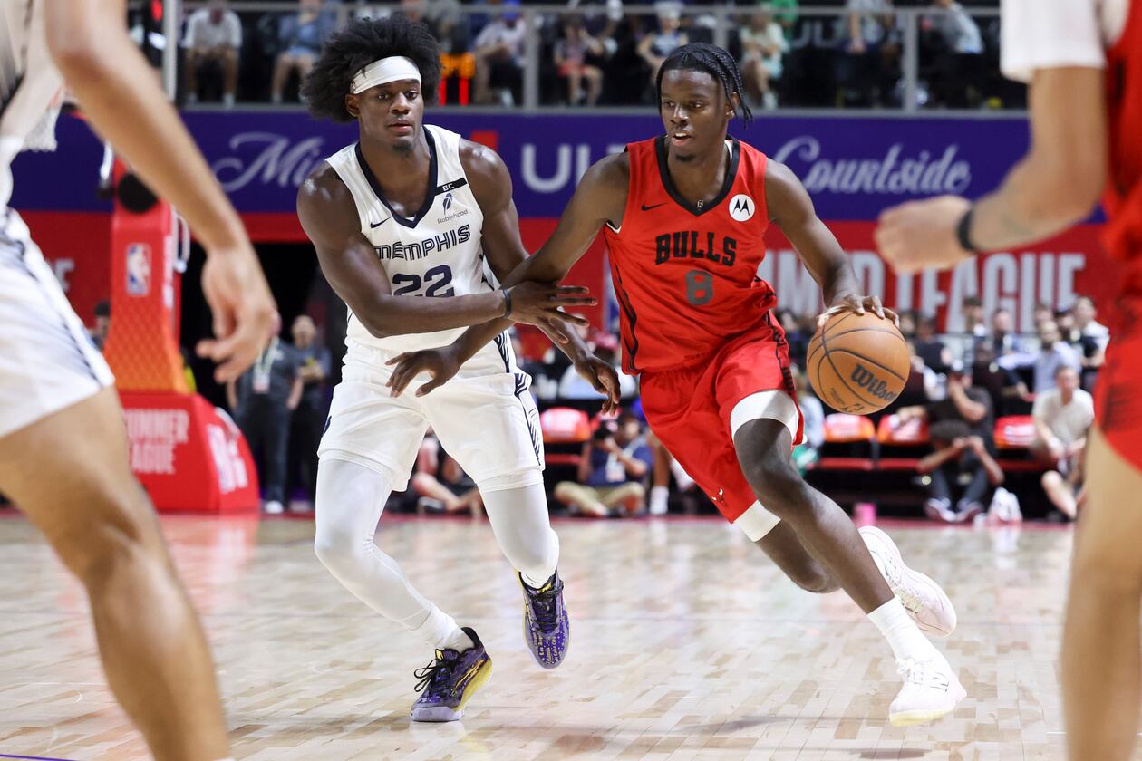 Bulls forward Caleb Wilson (right) drives against Grizzlies forward Taylor Hendricks during their NBA Summer League basketball game Friday, July 10, 2026, in Las Vegas. (Ian Maule/AP)