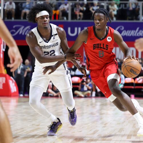 Bulls forward Caleb Wilson (right) drives against Grizzlies forward Taylor Hendricks during their NBA Summer League basketball game Friday, July 10, 2026, in Las Vegas. (Ian Maule/AP)