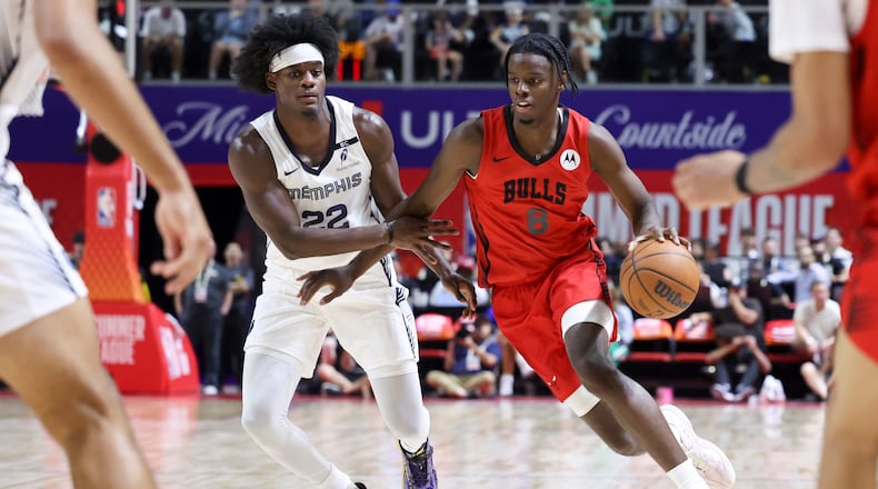 Bulls forward Caleb Wilson (right) drives against Grizzlies forward Taylor Hendricks during their NBA Summer League basketball game Friday, July 10, 2026, in Las Vegas. (Ian Maule/AP)