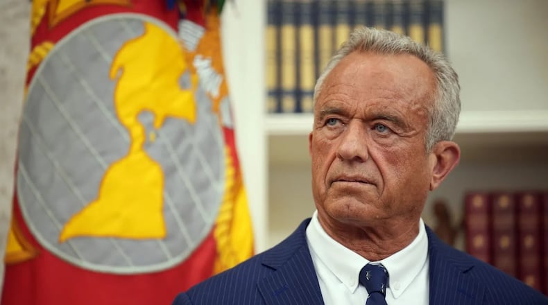 Robert F. Kennedy Jr. listens before being sworn in as secretary of Health and Human Services on Feb. 13. (Andrew Harnik/Getty Images)